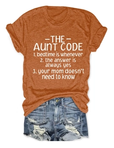 Flat lay of burnt orange crew neck T-shirt with white Aunt Code slogan print