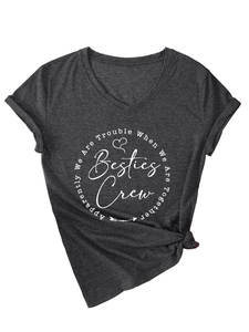 Detail of charcoal grey V-neck T-shirt featuring rolled sleeves and side knot design