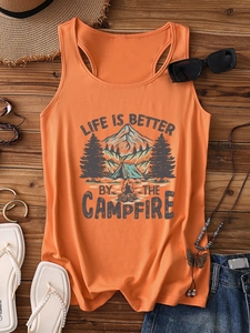 Flat lay of an orange camping tank top with Life Is Better By The Campfire print and accessories