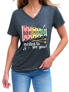 Detail of dark grey V-neck T-shirt with musical xylophone print and excited text