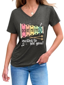 Detail of V-neck heather grey tee with colorful xylophone print and musical slogans