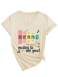 Macro shot of apricot V-neck T-shirt showing colorful xylophone print and side-tie knot