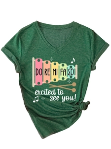 Detail of dark green V-neck T-shirt with musical rainbow print and knotted hem