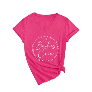 Rose pink V-neck T-shirt with white 'Besties Crew' letter print in a flat lay style