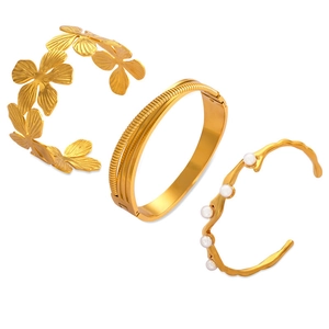 Three-piece gold-plated titanium steel bracelet set featuring floral and pearl designs