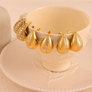 Elegant gold-plated teardrop and crescent earrings set with micro-inlaid rhinestones