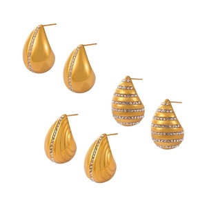 Three pairs of gold-plated teardrop earrings with crystals in various textured designs