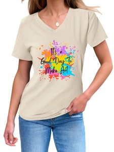 Detail of artistic splash ink print and text on cream V-neck short sleeve cotton tee