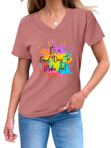 Detail of V-neck pink t-shirt featuring 'It's a Good Day To Make Art' colorful graphic print
