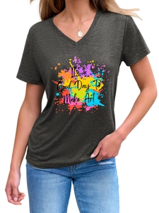 Detail of V-neck dark grey t-shirt with colorful paint splash art and motivational text