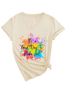 Flat lay of a beige V-neck T-shirt with art print and trendy side-knot detail