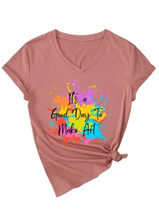 Detail of the V-neck t-shirt showing artistic print and stylish front hem knot decoration