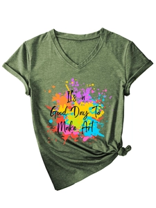 Detail of V-neck t-shirt featuring colorful paint splatters and artistic text print