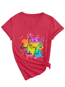Detail of red V-neck T-shirt with splash art print and side knot design