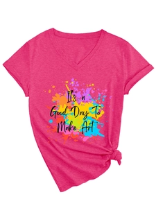 Macro detail of hot pink V-neck T-shirt with artistic splash print and knotted hem