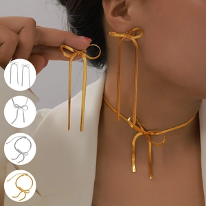 Set gioielli con fiocco, collana a serpente in metallo e orecchini a nappa lunga dorati