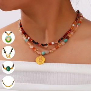 Handmade mixed natural stone beaded necklace set with a gold embossed medallion pendant