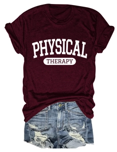 Flat lay of wine red Physical Therapy t-shirt and light blue distressed denim shorts