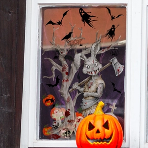 Detailed Halloween window stickers showing rabbit, bats, and trees on glass