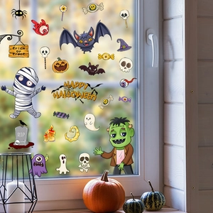 Detail view of cartoon Halloween window clings with mummy and ghost on glass