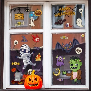 Cartoon Halloween window decals featuring ghosts, bats and pumpkins on glass