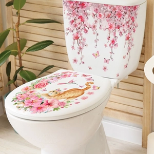 Détail des stickers fleurs de cerisier roses et décalcomanies chat sur les toilettes