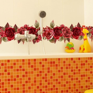 Realistic red rose wall sticker applied to bathroom tiles under a shower head