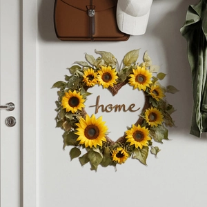 Detail of sunflower heart-shaped wreath with wooden home sign on a grey wall