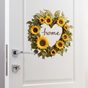 Detail of heart-shaped sunflower wreath with wooden home sign on a white door