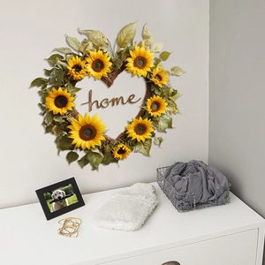 Heart-shaped sunflower wreath with home sign hanging on minimalist home interior wall