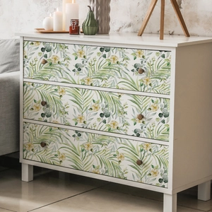 Minimalist floral wall sticker with green palm leaves and yellow flowers on white dresser