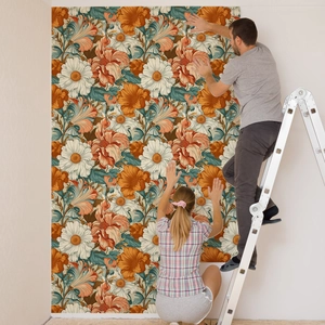 Detailed view of floral wallpaper application featuring daisies and orange lilies on white walls
