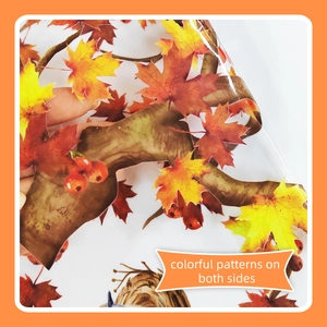 Detail of double-sided autumn maple leaf window sticker with vibrant colors and clear film