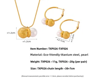 Detail showing hammered gold ball and pearl pendant on a titanium steel necklace set