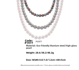 Detail of multi-size high-luster shell pearl necklaces in white, grey, and brown tones