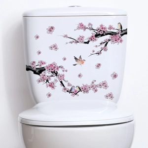 Sticker mural floral avec fleurs de cerisier et oiseaux sur réservoir de toilettes