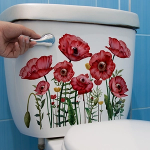 Détail de stickers coquelicots rouges avec cœurs pupilles sur réservoir de toilettes