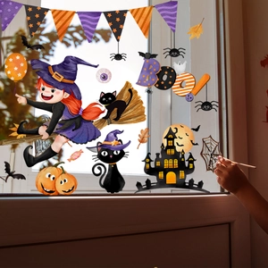 Detail of Halloween window stickers featuring a cartoon witch, black cat, and haunted castle
