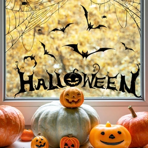 Halloween window decals featuring black bats, spiders, and pumpkins on glass panes