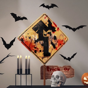 Close-up of Halloween diamond warning sign with bloody bats and spider web graphics