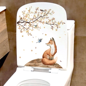 Creative fox and floral watercolor decal on a white toilet seat cover for bathroom decor