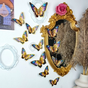 Close-up of 3D blue and gold butterfly wall stickers with artistic painted texture