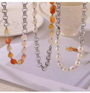Close-up of pearl and amber agate beads mixed with 18k gold plated stainless steel chain