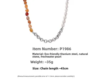 Macro detail of natural stone, freshwater pearl, and titanium steel chain necklace