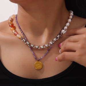 Double layered pearl and purple beaded necklace with a gold coin Good Luck pendant