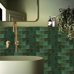 Detailed view of dark green marble tile texture with elegant gold bathroom fixtures
