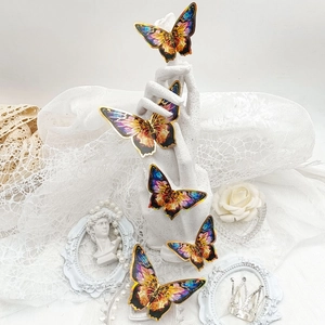Detail of 3D blue and gold butterfly wall stickers with metallic laser finish effect
