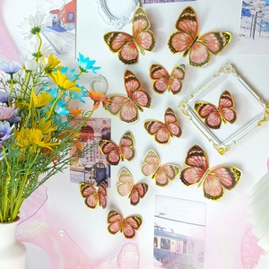 Stickers muraux papillons 3D roses à bords dorés pour décoration intérieure lot de 12