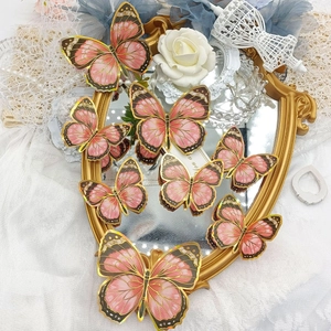 Papillons muraux 3D roses aux bords dorés pour décoration intérieure élégante