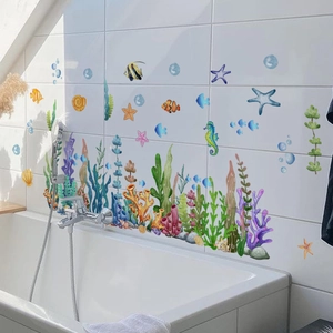 Marine life PVC wall stickers featuring clownfish and coral on bathroom tile wall